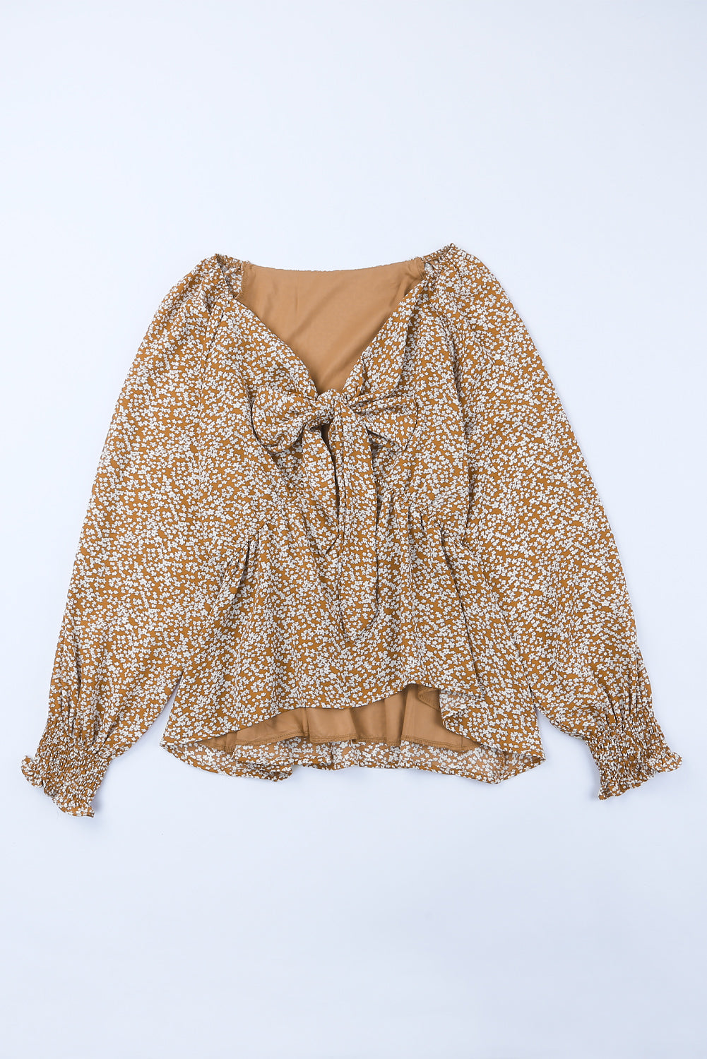 Linda blusa de manga larga con volantes y lazo delantero con estampado floral
