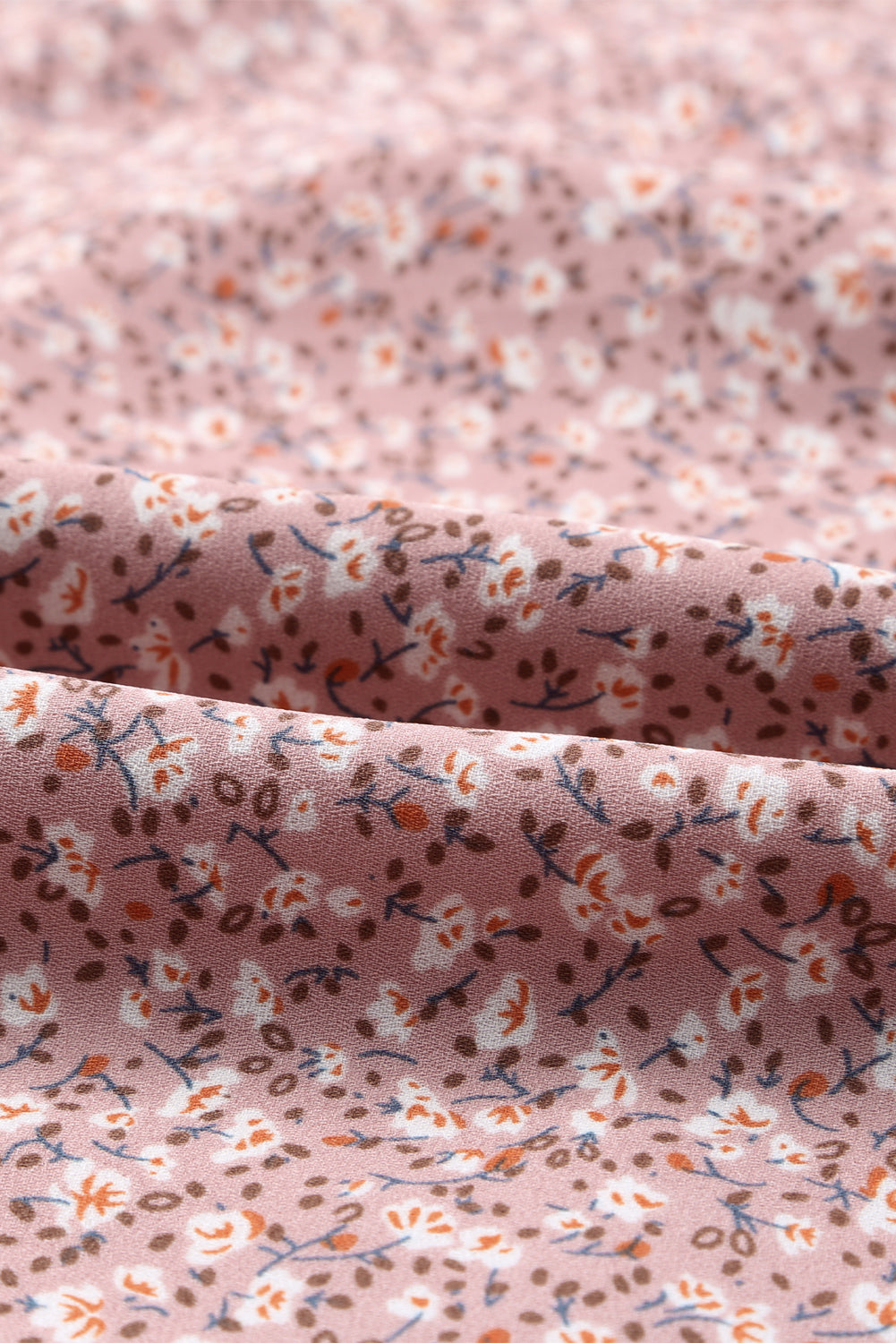 Linda blusa de manga larga con volantes y lazo delantero con estampado floral
