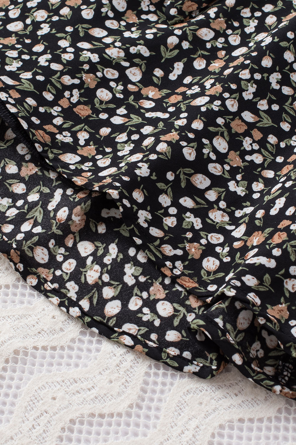 Linda blusa de manga larga con volantes y lazo delantero con estampado floral