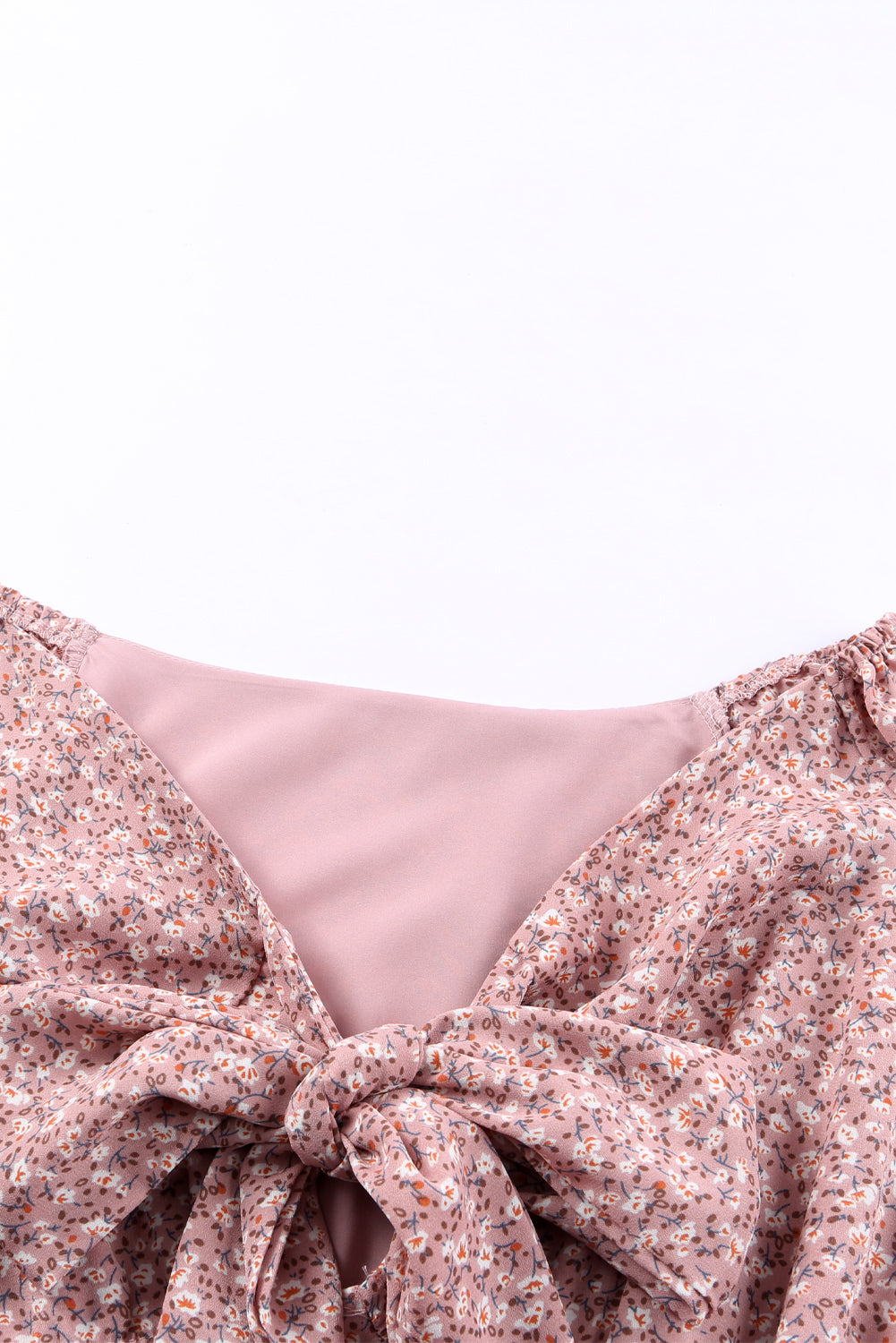 Linda blusa de manga larga con volantes y lazo delantero con estampado floral